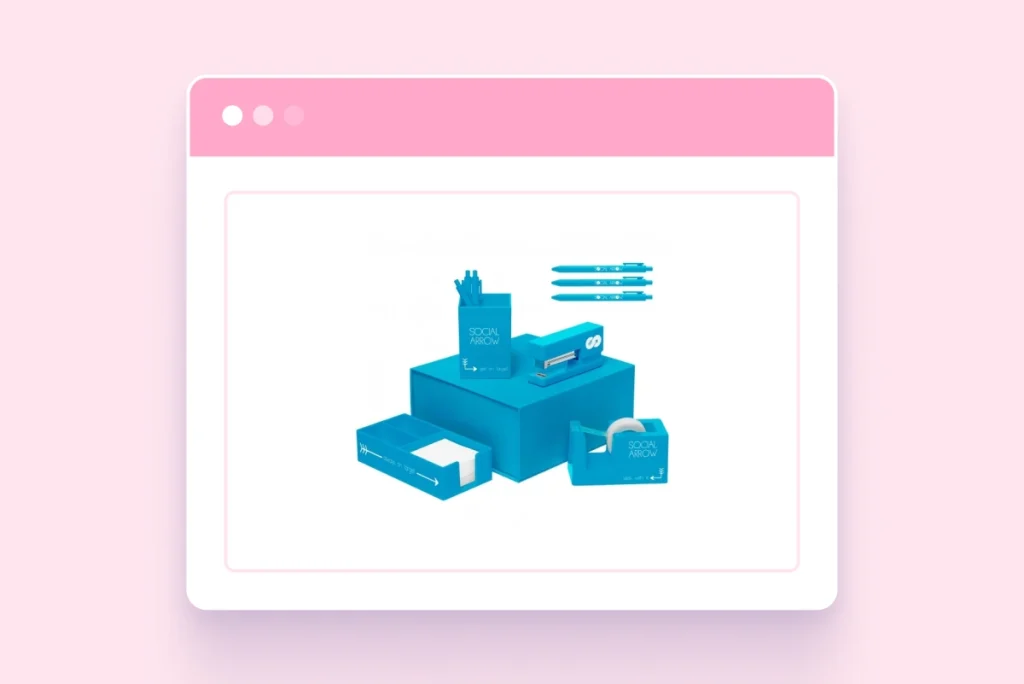 Custom branded desk accessories including pens, pen holder, tape dispenser, and notepad displayed inside a stylized browser window mockup on a pink background.
