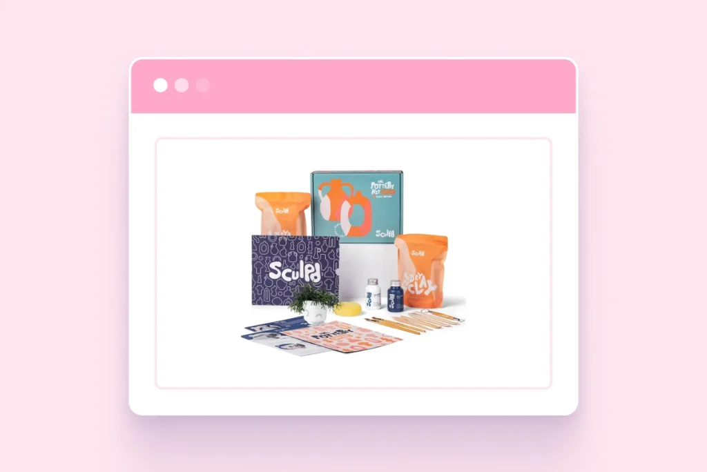 A personalized sculpd pottery starter kit featuring two bags of air-dry clay, a variety of sculpting tools, white and blue paint, brushes, and instructional guides arranged in front of vibrant, branded packaging.