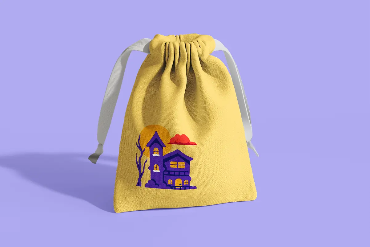 Yellow drawstring party favor bag printed with a purple haunted house illustration, bare tree, full moon, and red clouds