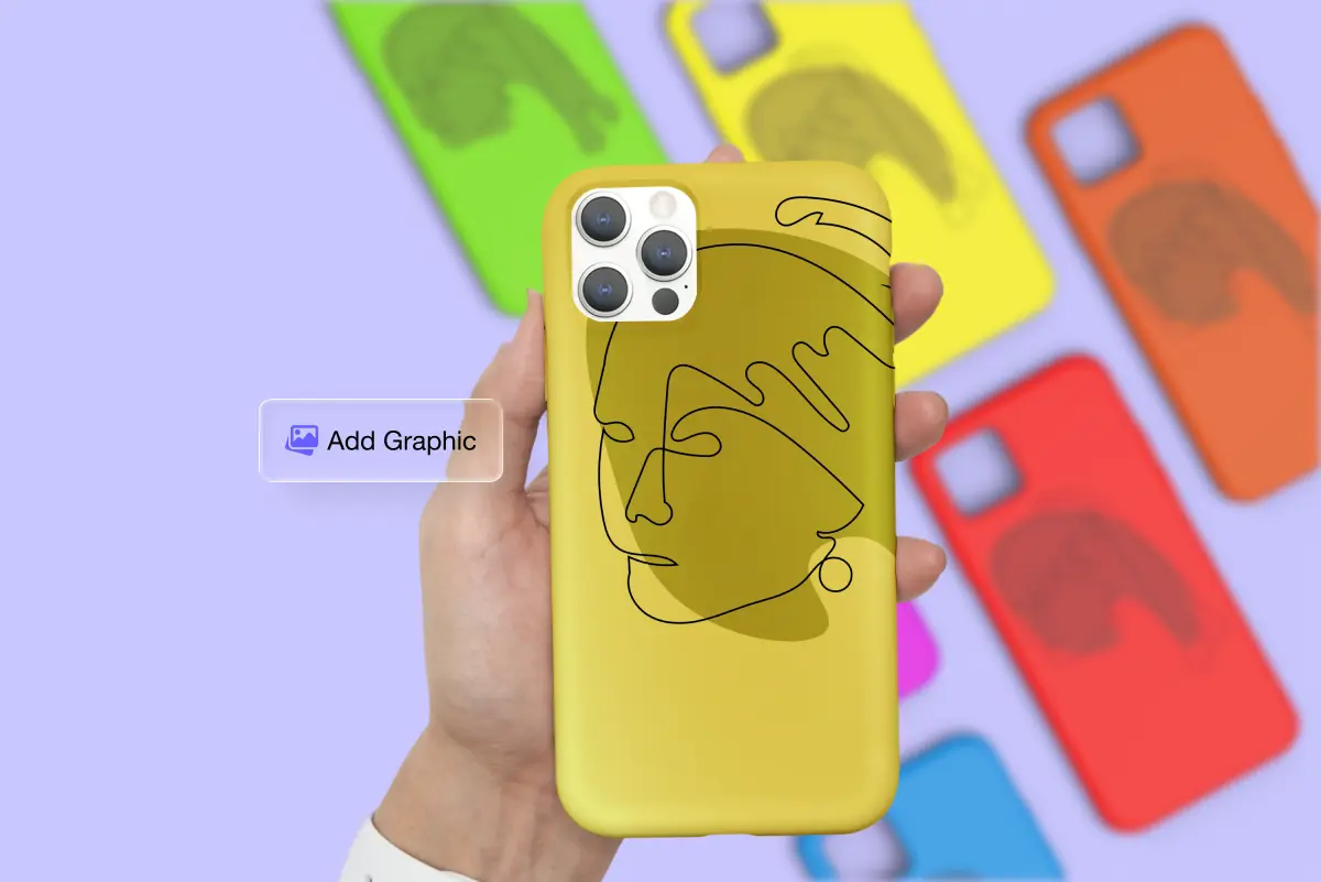 Hand holding a mustard-yellow phone case with a single-line face illustration, an "Add Graphic" button beside it. Blurred phone cases in green, yellow, orange, red, pink, and blue are scattered in the background