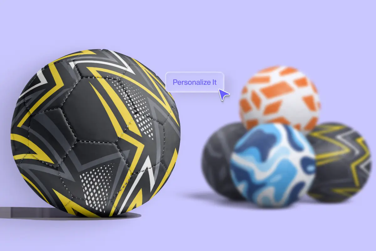 Custom soccer ball with black, yellow, and white geometric design in focus, "Personalize It" tooltip beside it. Blurred alternate balls in orange/white, blue/white, and black/yellow patterns are grouped in the background